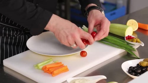 chef cutting vegetables in kitchen