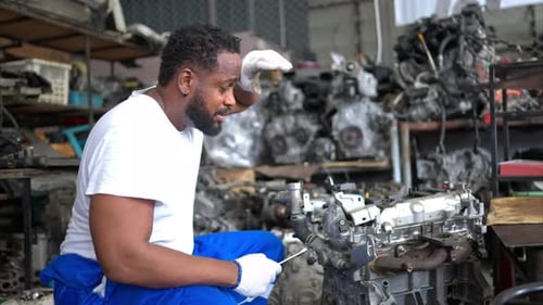 Men repairing car engine in auto repair shop, Selective focus.