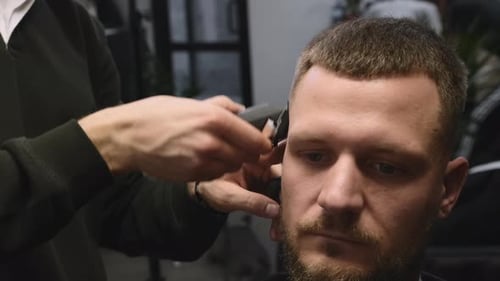 Young Man Gets Stylish Haircut in Professional Barbershop