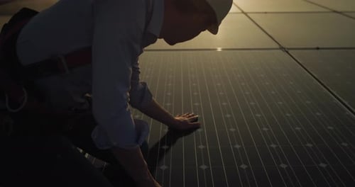 Cinematic shot of assistance technical worker in uniform checking operation and efficiency of phot