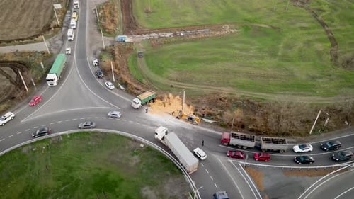 Car Crash Traffic Accident Wheat Grains Scattered Along Road After Breaking Overturning Cargo Truck