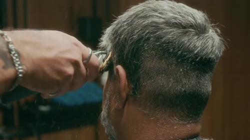 Male Hairdresser Trimming Hair on Temples with Clipper for Crew Cut