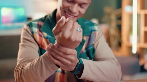 Wrist, pain and hands with man in home for fibromyalgia, fatigue or orthopedic emergency