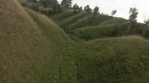 Cinematic Drone Flying Over the Grass Canyon in Nature
