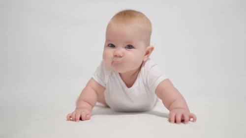 Portrait of a contented baby on a white background