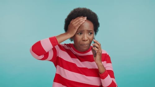 Phone call, stress and sad with black woman in studio for bad news, grief and medical update