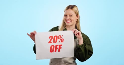 Happy woman, poster and sale for promo deal or discount price against a blue studio background