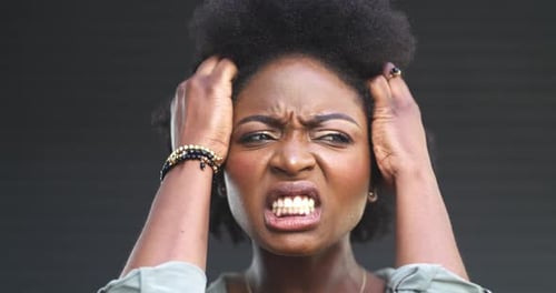 Angry, woman and frustrated face in studio with dark background and mockup space