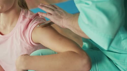 The Personal Trainer Gives the Athlete a Massage to Restore Physical Functions