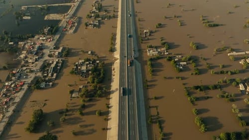 Aerial view of severe flood impacting highway and villages in Jalalpur Pirwala