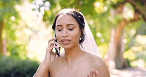 Phone call, angry and a bride in a garden on her marriage day, arguing or feeling upset at bad news