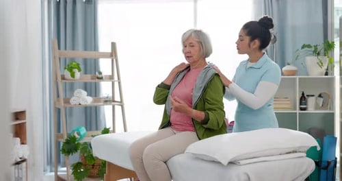 Physiotherapy, massage and senior woman consulting physiotherapist for injury