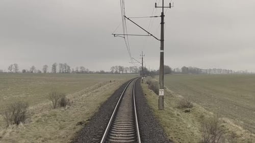 View on Railroad Track From the Back Window of Fast Train Bullet Train Rides on the Railway Track