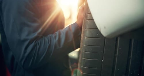 Hands, remove and change tire for car repair, alignment and vehicle maintenance with service