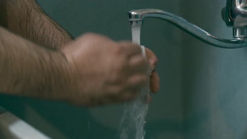 Person Washing Hands With Soap By The Running Water - Protection Against Coronavirus, COVID-19 - clo
