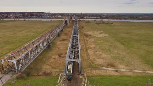 Train with Full Wagons of Coal Moving By Railroad Bridge
