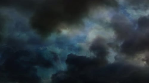 thick clouds in the blue sky and lightning in it