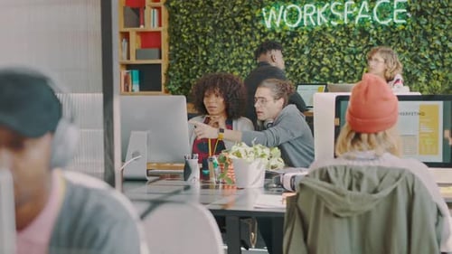 Colleague, creative office and web designer team working together on homepage in a design agency