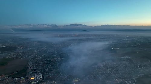 Aerial night view of polluted Bishkek covered by thick smog