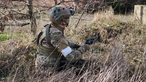 Army Soldier Shooting with Firearm in Battlefield