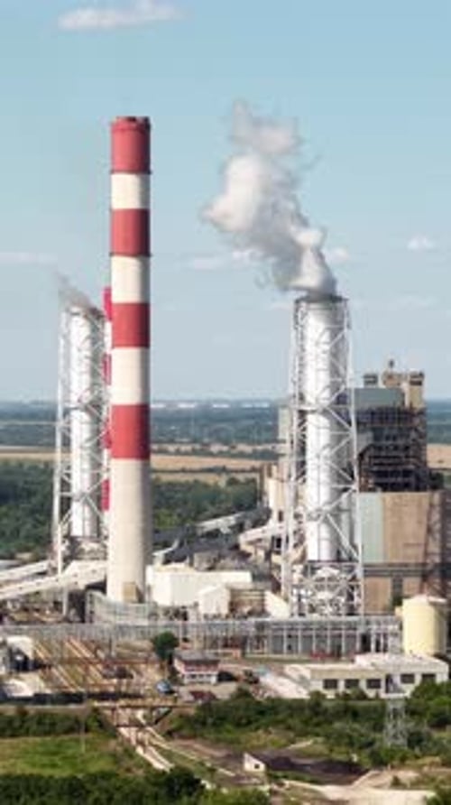 Vertical Drone Shot of Coal Power Plant, Smoke From Chimney and Power Station Facilities