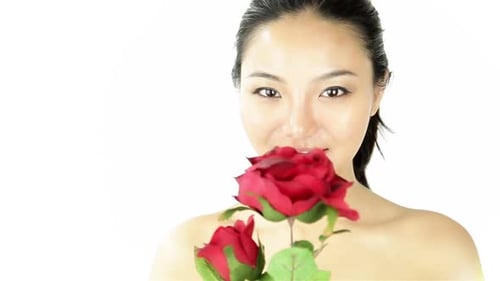 Attractive woman from east asia in her 20s isolated in studio