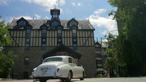 White classic car entering an old building (Cinematic Footage)
