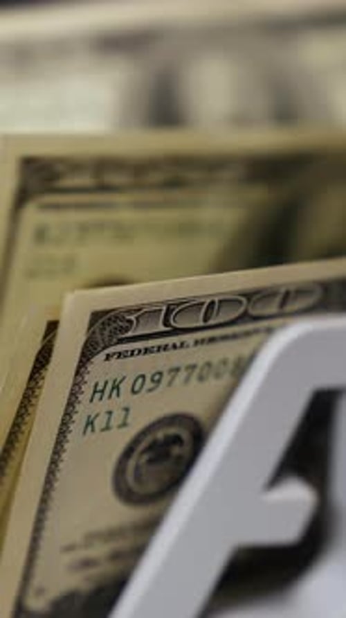 Counting dollar banknotes. Money counting equipment for paper money calculation. Vertical video