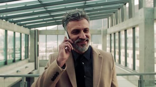 Businessman with Smartphone, Making a Phone Call