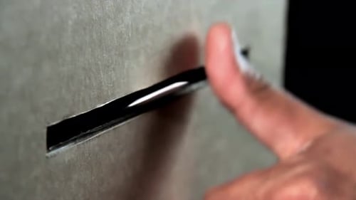 A Man Voting Inserting Paper into Ballot Box. Close-up. 4K Resolution.