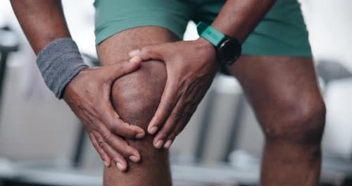 Knee pain, hands and sports person with massage for training injury, fitness or wellness in gym