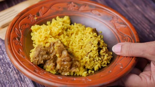 Boiled Yellow Rice with Meats on a Plate