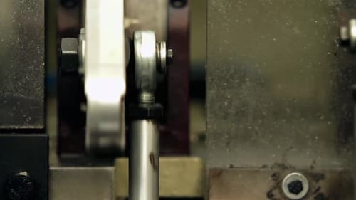 Crankshaft of an Industrial Machine in Motion. Close Up. 4K Resolution.