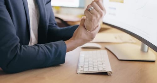 Closeup man, wrist pain and injury at computer from osteoporosis, orthopedic and typing