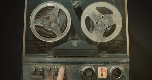 Vintage tape recorder with sound reels spinning