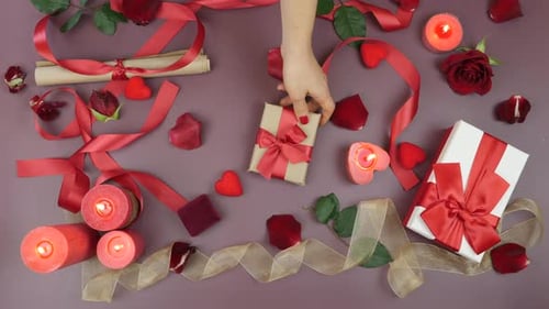 Female hand is giving gift box to male hand at St, Valentine's Day, Holiday presents