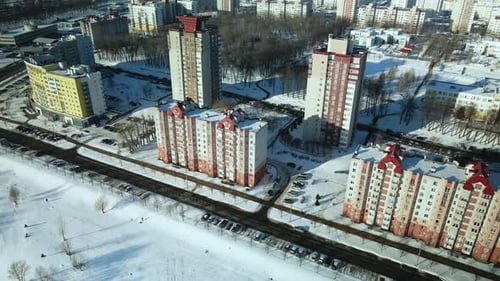 City quarters. Multi-story houses. Winter cityscape.