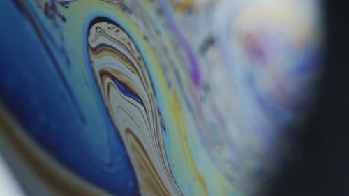 Macro Shot of Colorful Rainbow Hues on Soap's Thin Film Surface