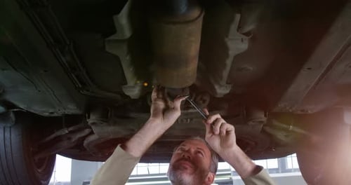Mechanic servicing a car