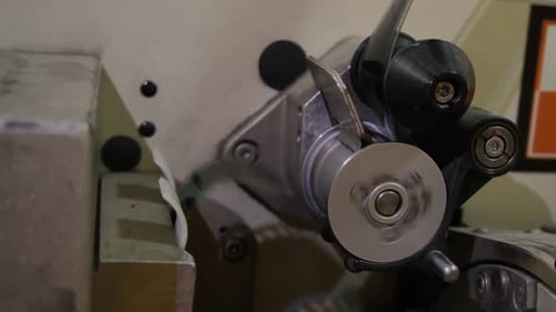 Equipment with Roller Moves Strip of Celluloid to Show Movie