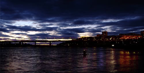 City sunset at river