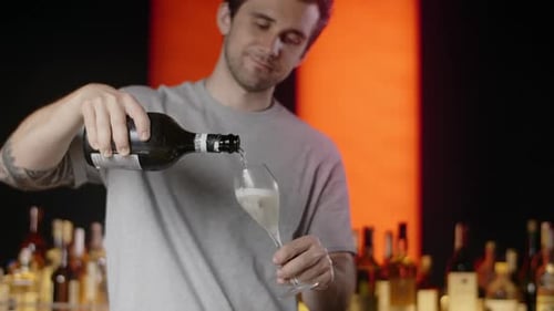 Barman Pours Sparkling Wine to the Wine Glass at the Bar Counter in Slow Motion Full 240 Fps Prores