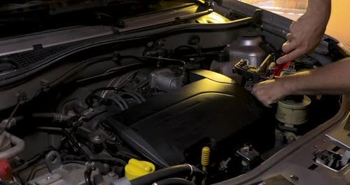 Maintenance on the vehicle, fixing the engine, tightening screws. mechanical workshop