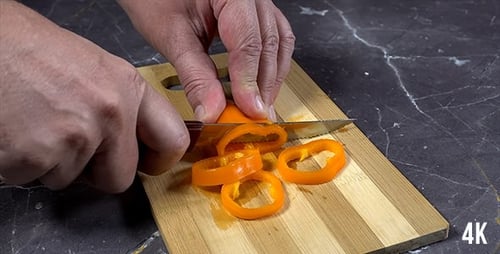 Man Cuts Paprika