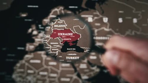 Ukraine on the World Map Under Magnifying Glass