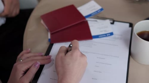 Client Signing a Contract for the Provision of Tourist Services at Travel Agency