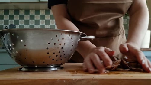 Woman Prepares Mushrooms