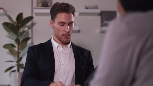 Man and Woman Having Talk and Shaking Hands During Business Meeting at Table in Modern Office Spbi