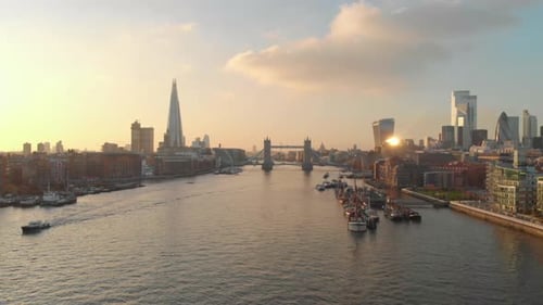 dolly forward drone shot London city centre tower bridge shard gherkin at sunset