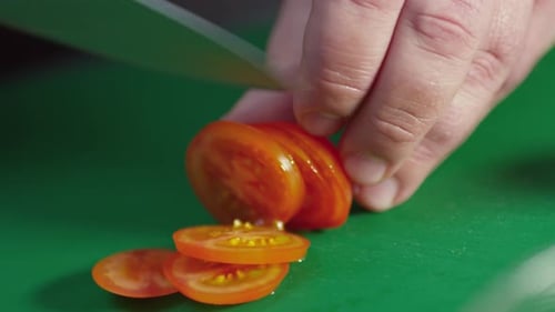 Chef Slicing Cherry Tomato